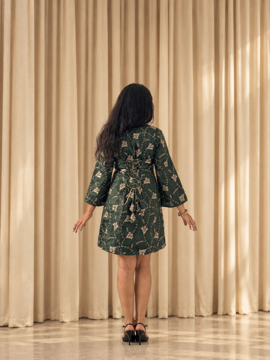 mazo Ivy dress, back view of the lace up back and bell sleeves