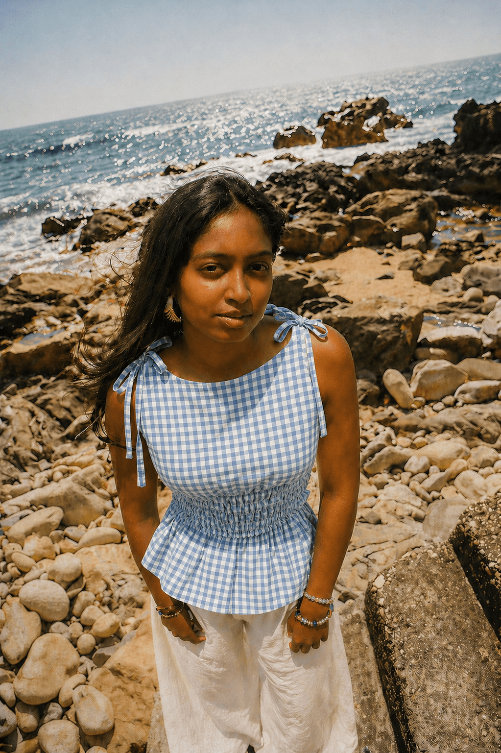Girl wearing blue checked top