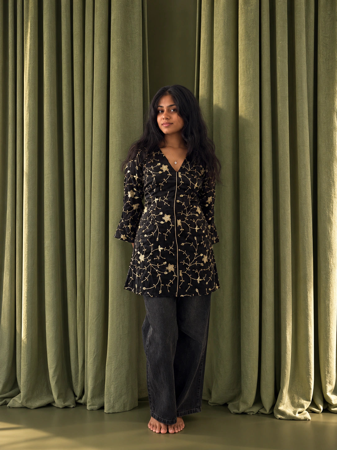 mazo Buri Nazar black dress styled as a short kurti, worn with black wide leg jeans