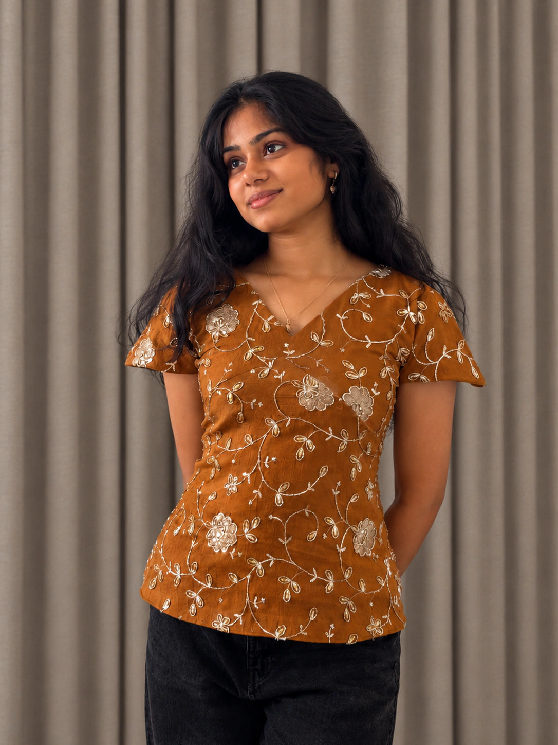 mazo Pataka rust embroidered peplum top for women, front view