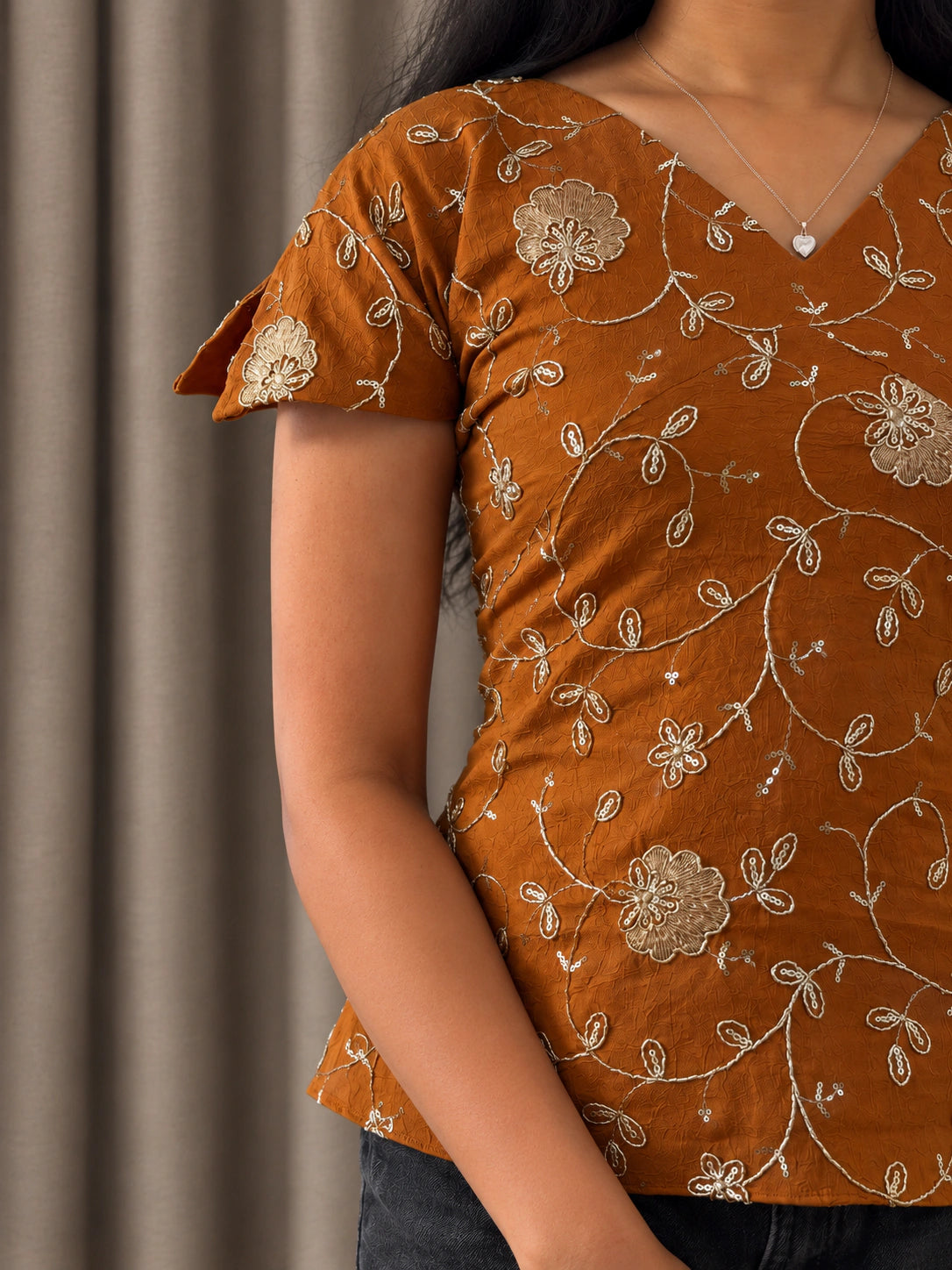 mazo Pataka top, close view of the hand finished aari embroidery, sequins and the petal sleeve
