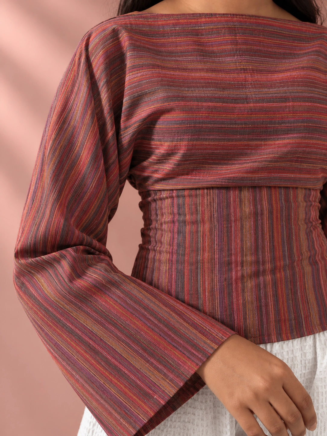 mazo Close view of the Rosé Stripe Tie-Back Top striped fabric and bell sleeve