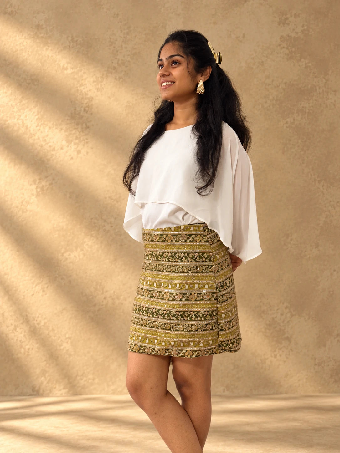 mazo Tamasha mini skirt styled with a white top and white heels