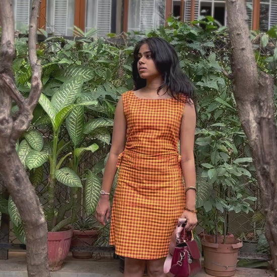 Model wearing the Summer Jam red and yellow gingham Madras-check midi dress