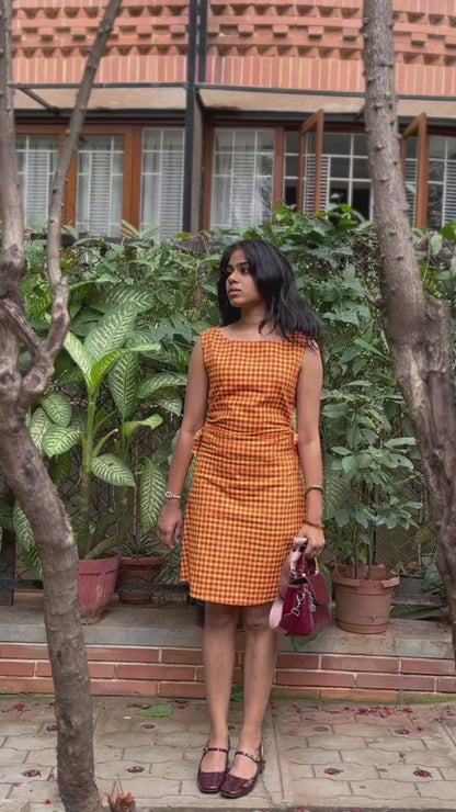 Model wearing the Summer Jam red and yellow gingham Madras-check midi dress